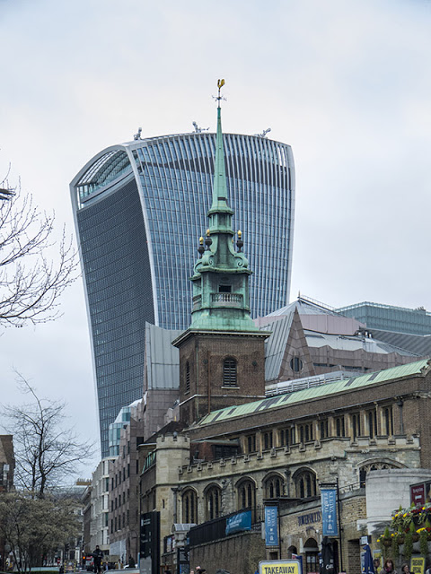 Old and New London's oldest church in front of a modern building (the "Walkie Talkie")